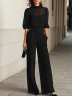Conjunto Valentina de tres piezas en negro: top camisola transparente y pantalón de pierna ancha